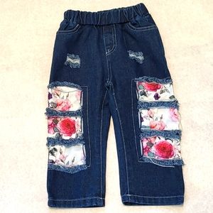 Dark denim distressed jeans with floral inserts